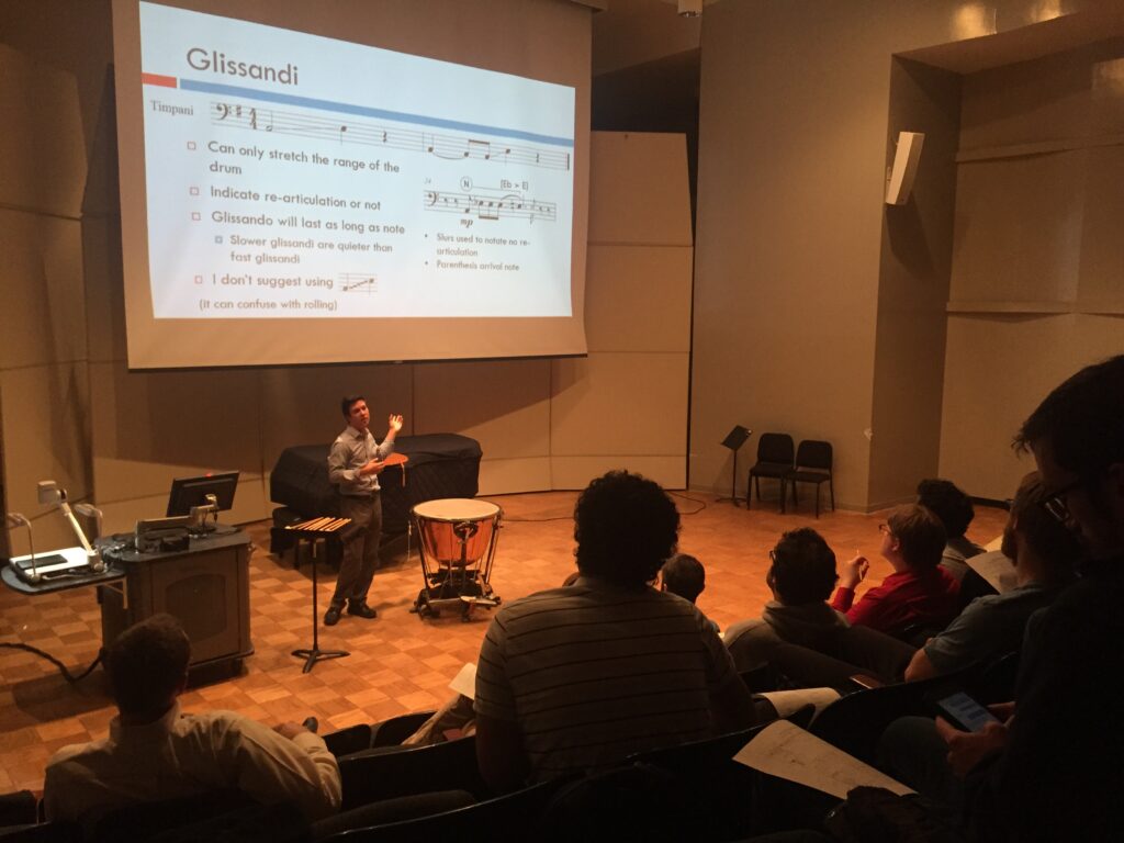 Composer Tim Corpus presenting about composing for timpani at Illinois State University.